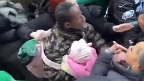 UPDATE: Moment a Philadelphia Eagles Supporter was captured fighting with a baby